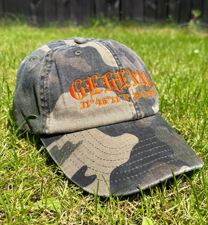 Camouflage baseball cap with orange text